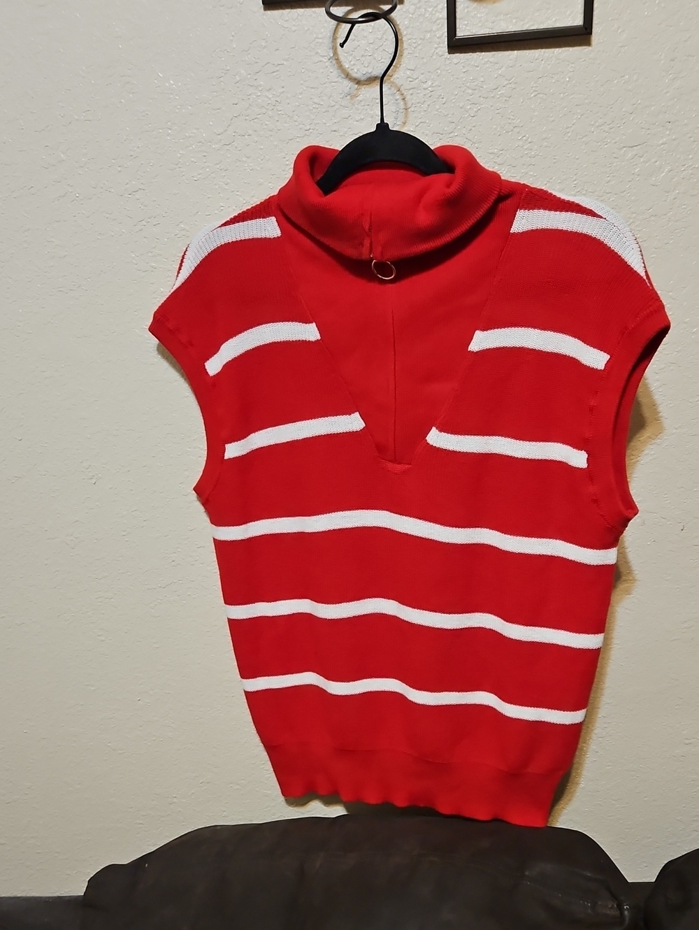 Red Sleeveless Turtleneck Sweater with White Stripes and Ring Accent